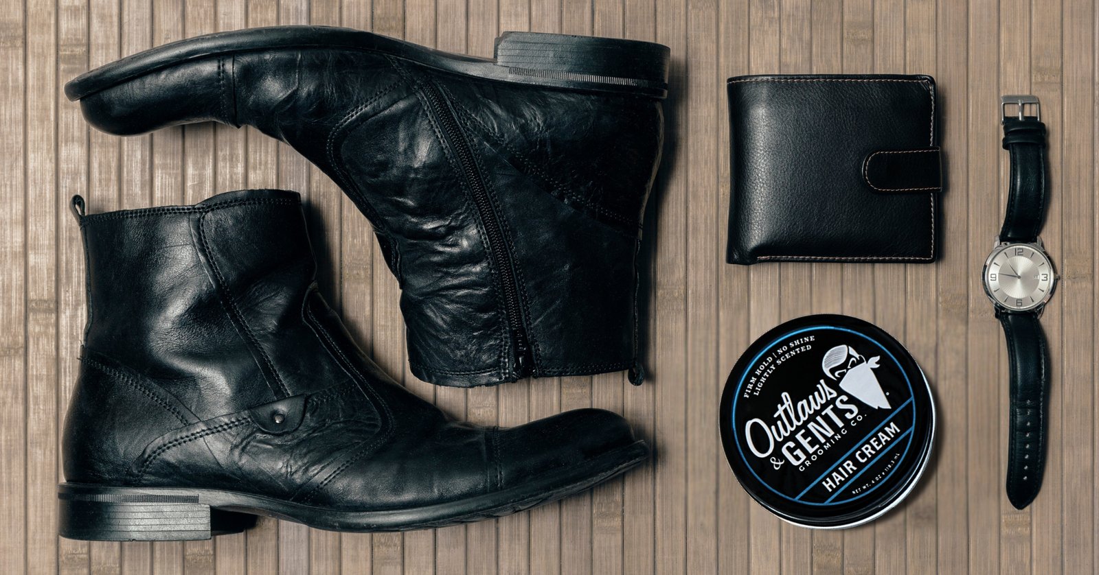 Outlaws & Gents hair cream with men’s leather boots, watch, and wallet